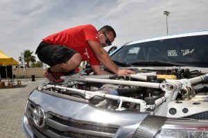 A busy day for mechanics at Yas Marina Circuit.