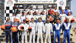 FUJAIRAH, UNITED ARAB EMIRATES - APRIL 07: XCAT team drivers pose for a group photo after the race for pole position during the Fujairah Grand Prix - the first round of the UIM XCAT World Series 2016 where 14 boats are competing. XCAT, short for extreme catamaran, is one of the most challenging and extreme forms of powerboat racing in the world at the Fujairah International Marine Sports Club on April 7, 2016 in Fujairah, United Arab Emirates. (Photo by Darren Arthur/Getty Images for XCAT)